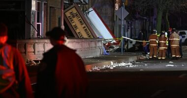 Authorities work the scene at the Apollo Theatre in Belvidere, Illinois,  after a severe spring storm caused damage and injuries during a concert,