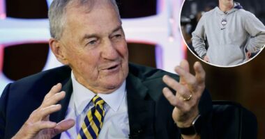 Former UConn coach Jim Calhoun shares in Dan Hurley's success