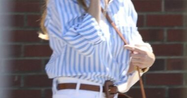 Spot the left hand: Reese Witherspoon had no ring on her wedding finger Friday during her first public sighting since the shock news that she is getting divorced