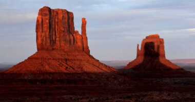 Towering Monument Valley buttes display sunset spectacle