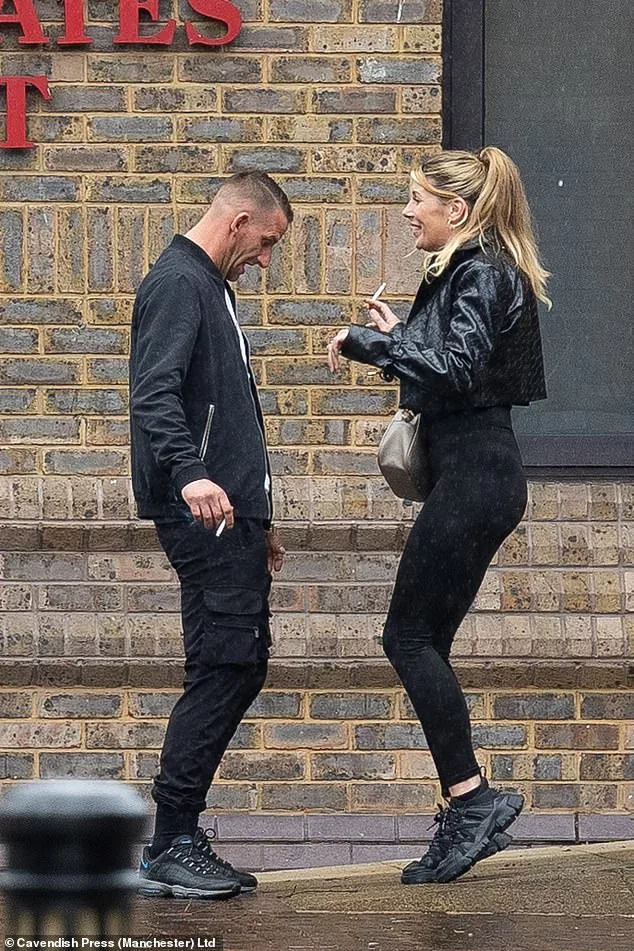 Two shameless yobs are caught dancing and laughing outside court