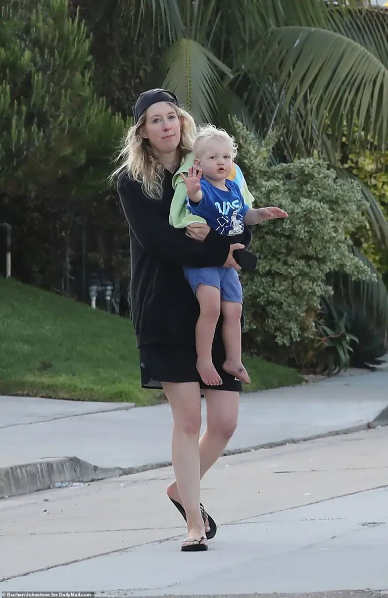 Elizabeth Holmes spends final weekend at beach with partner and two kids ahead of prison sentence