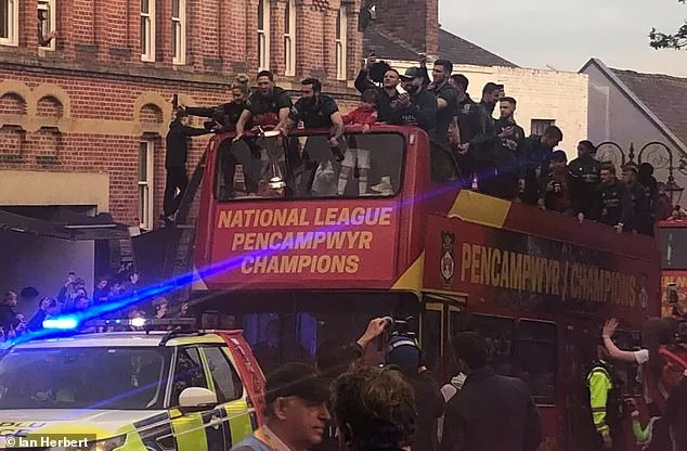 Thousands of fans line the streets to celebrate Wrexham in open-top parade after promotion