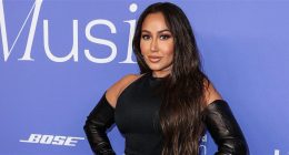 Adrienne Bailon Is Serving ‘Curves & Cellulite’ In Black Swimsuit During Family Vacation In Ibiza