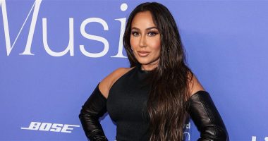 Adrienne Bailon Is Serving ‘Curves & Cellulite’ In Black Swimsuit During Family Vacation In Ibiza