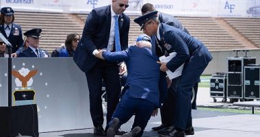 President Joe Biden is helped up after falling during the graduation ceremony at the United States Air Force Academy in Colorado. He fell while handing out diplomas to cadets