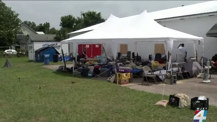 Dozens of people are living under a tent in Downtown Brunswick after a homeless shelter closed down