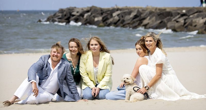 Queen Maxima, 52, and King Willem-Alexander, 56, beamed as they posed with their three daughters, Princesses Catharina-Amalia, 19, Alexia, 18, and Ariane, 16, and the family dog Mambo, in the pictures taken on the Zuiderstrand during the traditional photo session in the Hague