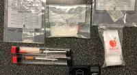 A Florida man has been arrested after choosing a random house to charge his cell phone and subsequently being charged with drug trafficking.