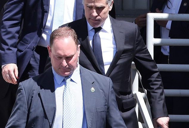 Hunter Biden will be hauled into court again next month and faces potential imprisonment if he doesn’t answer questions in his child support case, a judge ordered Monday. He is pictured leaving Batesville Court in Arkansas in May