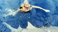 Ella Reed got ack in the water with sharks just a month after her viscous attack