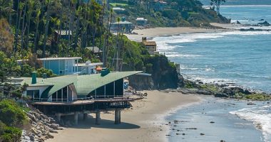 The iconic home was designed by late architect Harry Gesner, who died in 2022, after he and original homeowner Gerry Cooper 'discovered a hidden cove with good waves for surfing several miles up the coast, away from the Malibu Colony'