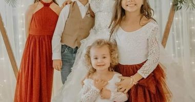 Ms Robinson with her four children on her wedding day