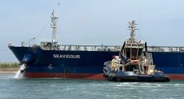 A tugboat works to refloat the Seavigour oil tanker to the waiting area in the Suez Canal, next to Ismailia, Egypt, on June 4, 2023