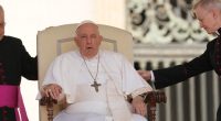 Pope sitting up, working from an armchair after abdominal surgery