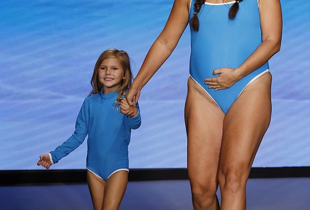 On Thursday evening, Martin and her daughter Aria while the Lain Snow runway in bright blue swimsuits and cowboy boots