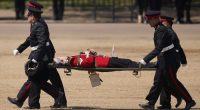 Troops feel the heat, and several faint, as Prince William reviews military parade