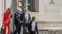 Trump attorneys Lindsey Halligan, from left, John Rowley and James Trusty exit the Department of Justice on Monday after meeting with federal prosecutors