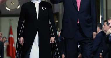 Turkish President Tayyip Erdogan, accompanied by his wife Emine Erdogan, greets participants during his inauguration ceremony at the Presidential Palace in Ankara