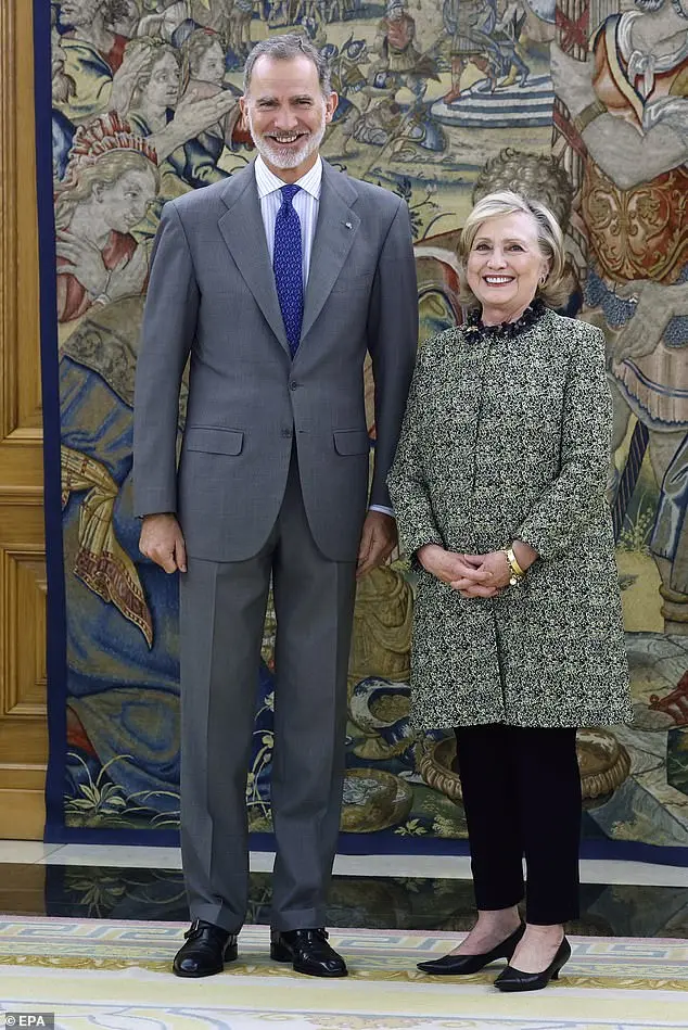 What a charmer! King Felipe kisses Hillary Clinton’s hands as she arrives for Barcelona conference