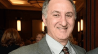 Who is Bruce Reinhart, Magistrate Judge who’s name appears on summons sent to Donald Trump