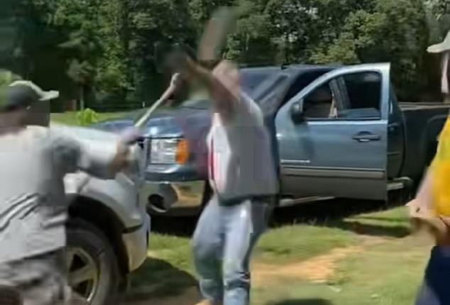 The two-on-one brawl, believed to be filmed near Jackson, Mississippi, erupted on the front lawn and left the initial aggressor shunned to the ground and covered in blood