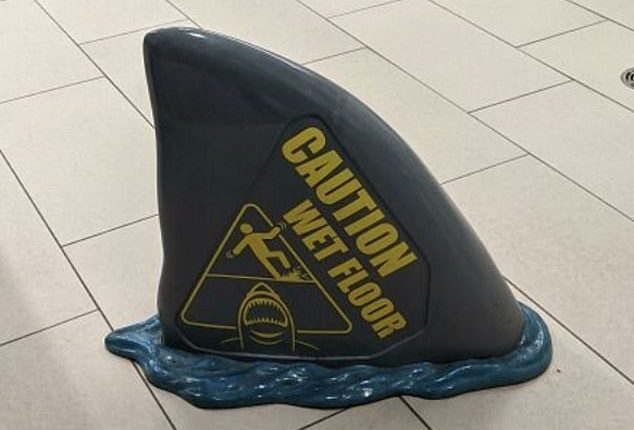 A clever shark fin wet floor sign, in Toronto, Canada , gave people the giggles
