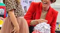 Kate appeared particularly taken with one little girl, who she joined to play with a large plastic red dog
