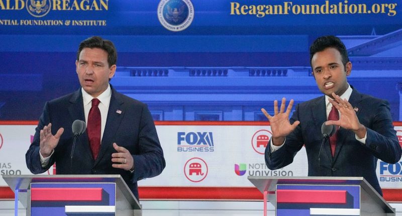 Candidates in the second GOP debate attack each other and Trump — even though he's absent
