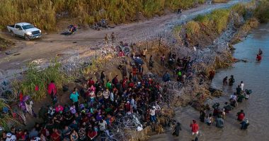 Migrants seen after crossing the Rio Grande river border from Piedras Negras, Mexico into the US on September 27, 2023