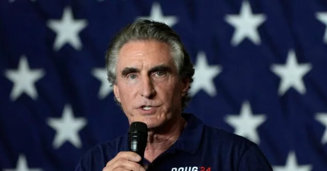 Exclusive — North Dakota Gov. Doug Burgum: Biden’s EV Push ‘Doesn’t Make Any Sense,’ U.S. ‘Not Anywhere Close to Being Prepared’