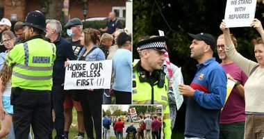 Furious locals stage protest outside luxury three-star Chichester Park Hotel after it closed itself down to house migrants in move that saw hundreds of events cancelled - including demonstrator's 26th birthday party