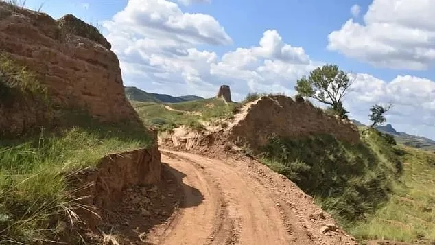 Pictured is the 'big gap' created by two construction workers who dug a hole so that their excavator could fit through