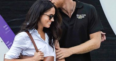Prince Harry abandoned royal formality, kissing Meghan on the head  and holding hands as they made their way to their seat at the wheelchair tennis during the Invictus Games in Toronto