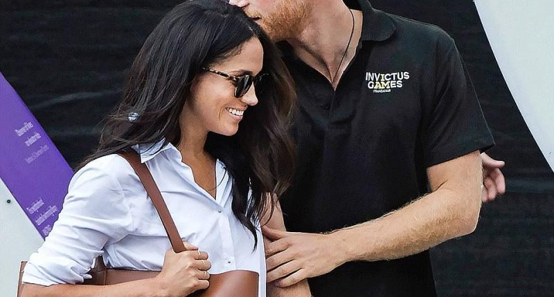 Prince Harry abandoned royal formality, kissing Meghan on the head  and holding hands as they made their way to their seat at the wheelchair tennis during the Invictus Games in Toronto