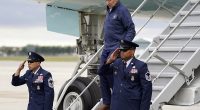President Biden slipped and caught himself before falling as he used the small stair case to exit Air Force One in Michigan