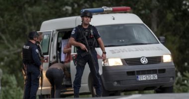 Kosovo mourns a slain police officer, some Serb gunmen remain at large after a siege at a monastery