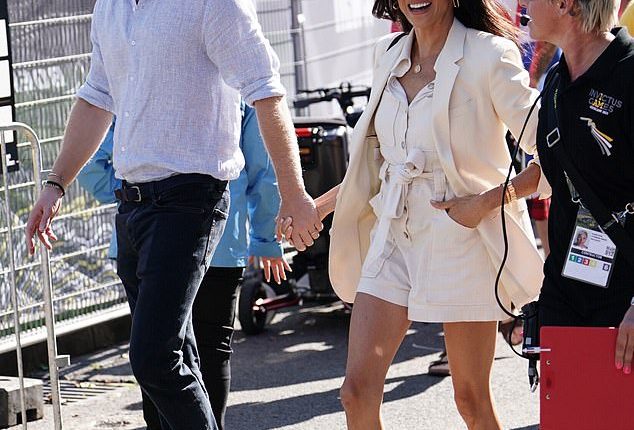Meghan Markle opted for another muted outfit today as she sported a matching cream playsuit and blazer to join Prince Harry at the Invictus Games