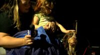 Missing toddler found sleeping on her dog, miles from Michigan home