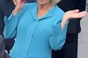Queen Camilla, who is currently on a state trip to France with King Charles, stylishly swats away a wasp