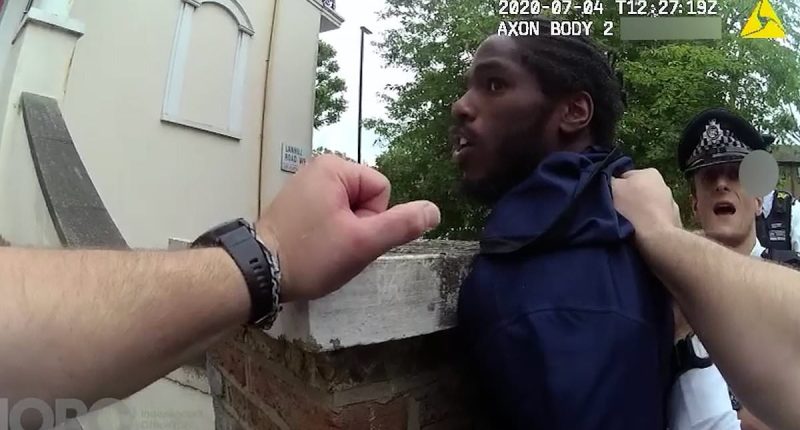 Moment sprinter Ricardo Dos Santos pleads 'what did I do?' as police scream at him to 'get out the car' and handcuff him in front of his son