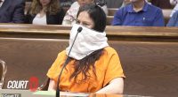 Taylor Schabusiness, 25, appeared to smile beneath the large white mask as she appeared in Brown County Circuit Court in a prison-issued orange jumpsuit with handcuffs around her wrists