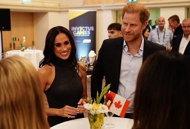 Meghan Markle turned on the charm as she joined Prince Harry at a reception thrown by the Canadian delegation to promote the 2025 Invictus Games that will feature winter sports for the first time