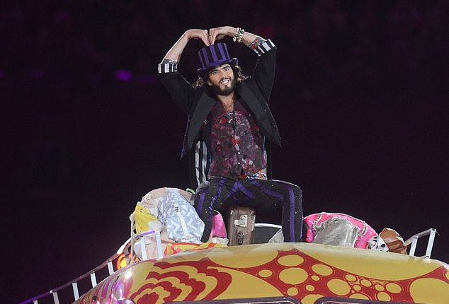A woman who claims Brand raped her against a wall in LA said she was 'triggered' into trauma after she saw him dressed as Willy Wonka on top of a psychedelic bus, performing a Beatles song, at the London 2012's closing ceremony (pictured)