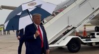 Donald Trump arrives in rainy Detroit