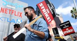 LOS ANGELES, CALIFORNIA - SEPTEMBER 18: Striking WGA (Writers Guild of America) members picket with striking SAG-AFTRA members outside Netflix studios on September 18, 2023 in Los Angeles, California. The Writers Guild of America and Alliance of Motion Picture and Television Producers (AMPTP) are set to meet for a new round of contract talks this week in the four-months long writers strike. (Photo by Mario Tama/Getty Images)