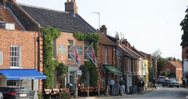 'Chelsea on sea' goes to war over second home owners: Villagers vote to ban Londoners buying holiday lets in their seaside haven and demand they pay TRIPLE council tax - but local businesses warn they need the income from tourism