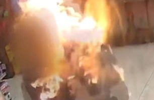 Horrific surveillance footage has revealed the moment a heroic store clerk was set ablaze by a homeless thug as he tried to stop him from stealing from his work place