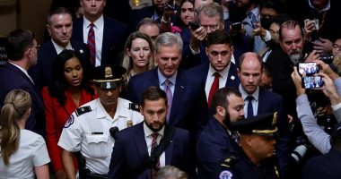 McCarthy is swarmed by reporters after a vote to oust him from the speaker's chair