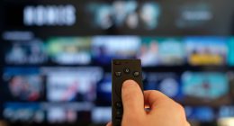 Remote control and screen - binge watching the favorite TV show